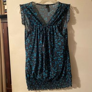 Very cute whimsical sleeveless top. Gathered bottom lined tank drawstring tie